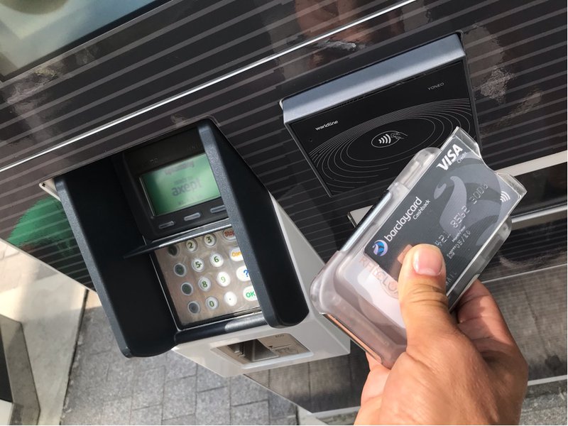 RFID Cloaked wallet being used at a contactless transport terminal, The Ultimate Wallet with RFID Protection, photo